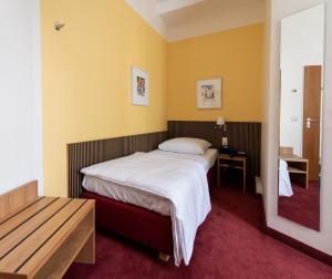 Posteľ alebo postele v izbe v ubytovaní Hotel Aigner