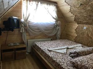 Postel nebo postele na pokoji v ubytování Садиба 2 Підкова чан та сауна + 24 fotografií