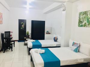 Postel nebo postele na pokoji v ubytování JPrime Apartelle