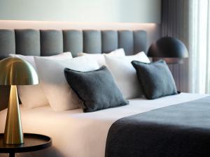 Posteľ alebo postele v izbe v ubytovaní Heritage Hill Hotel