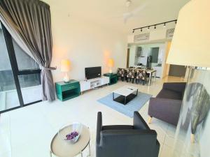 a living room with a couch and a table at Beacon Executive Suites in George Town