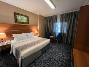 Postel nebo postele na pokoji v ubytování Saraya Harmony Hotel C
