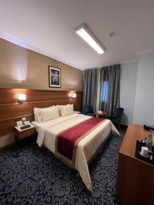 Postel nebo postele na pokoji v ubytování Saraya Harmony Hotel C