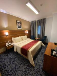 Postel nebo postele na pokoji v ubytování Saraya Harmony Hotel C