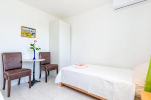 Ένα ή περισσότερα κρεβάτια σε δωμάτιο στο Villa Bind