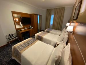 Postel nebo postele na pokoji v ubytování Saraya Harmony Hotel C