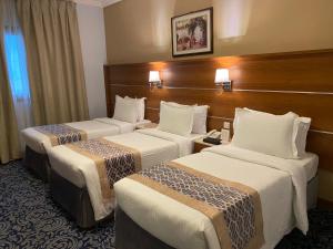 Postel nebo postele na pokoji v ubytování Saraya Harmony Hotel C