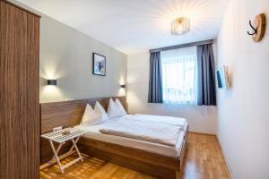 Postel nebo postele na pokoji v ubytování Haus Obauer by AlpenTravel