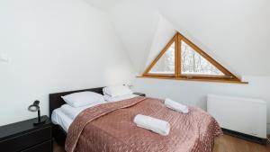Posteľ alebo postele v izbe v ubytovaní Apartamenty Sun & Snow Poronin