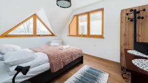 Posteľ alebo postele v izbe v ubytovaní Apartamenty Sun & Snow Poronin