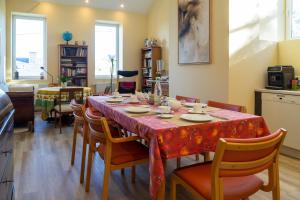 a dining room with a table and some chairs at DK Glasmanufaktur GmbH in Wurzbach