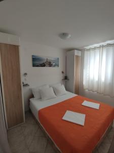 Postel nebo postele na pokoji v ubytování Apartman Mare Vir