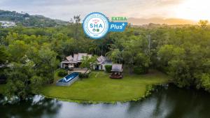 an aerial view of a house with a swimming pool at Banyan Tree Phuket in Bang Tao Beach