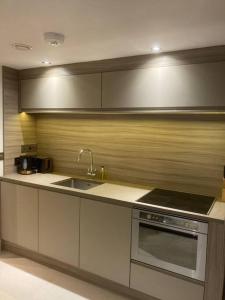 A kitchen or kitchenette at 48 Cocoa Suites, York City Centre