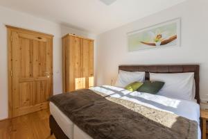 Un pat sau paturi într-o cameră la Appartement Hess Hinterstoder