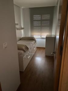 Posteľ alebo postele v izbe v ubytovaní TORREVIEJA