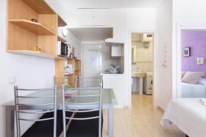 a small apartment with a table and a bedroom at Adeje Paraíso in Adeje +19 photos