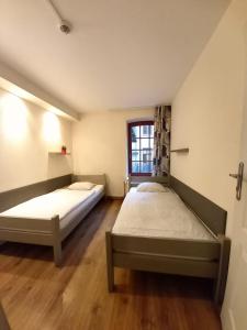 Un pat sau paturi într-o cameră la Hostel Orange