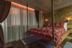 Postel nebo postele na pokoji v ubytování Onore dell amore 2 apartman sa djakuzijem