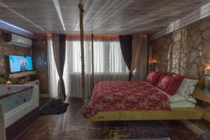 Postel nebo postele na pokoji v ubytování Onore dell amore 2 apartman sa djakuzijem