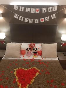 a bedroom with a bed with a bunch of hearts on it at Wellness Home Rome in Rome