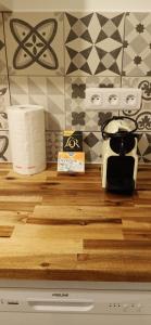 a kitchen counter with a toaster and paper towels at 5 min (450 meter) walk Tram T2: Puteaux/La Défense in Puteaux