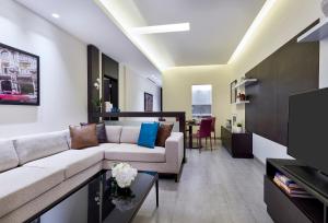 A television and/or entertainment centre at Staybridge Suites - Doha Lusail by IHG