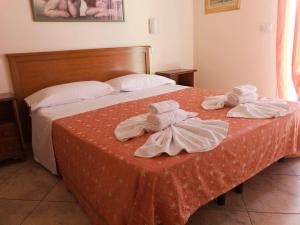 Tempat tidur dalam kamar di Hotel Franca