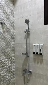 a shower stall in a bathroom with a shower head at Pool Villa Saraya in Ras al Khaimah