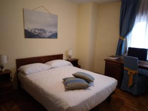 Postel nebo postele na pokoji v ubytování Hotel Belvedere Dolomiti