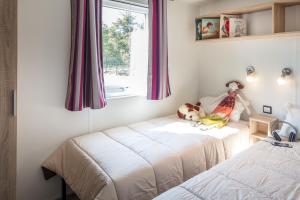 Postel nebo postele na pokoji v ubytování Camping Paris-Est