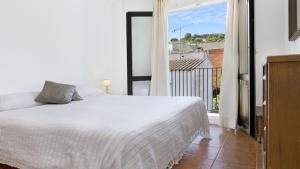 A bed or beds in a room at 1Sarri - Llafranc