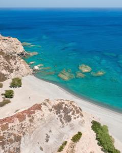 an aerial view of a beach with rocks in the water at Arkasa Palace in Arkasa