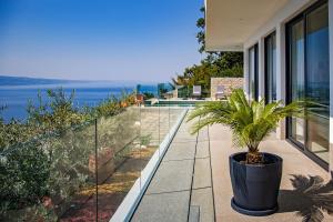A balcony or terrace at Villa Dispet with heated pool, jacuzzi, sauna and cinema