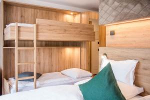 A bed or beds in a room at Vitaurina Royal Hotel