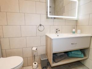 a bathroom with a sink and a toilet at Robin's Rest in Stoke on Trent