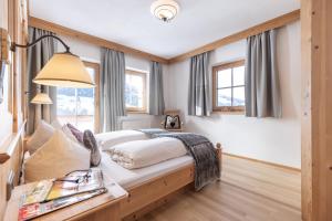 Łóżko lub łóżka w pokoju w obiekcie Wellnessappartements Margit