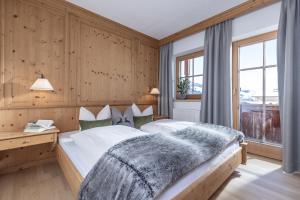 Łóżko lub łóżka w pokoju w obiekcie Wellnessappartements Margit
