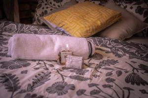 a pink purse sitting on top of a bed at Lovely 1-bedroom Garden Cottage in Klerksdorp