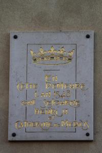 a sign with a crown on top of it at La tour Bocsozel in La Côte-Saint-André