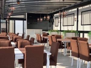 a row of tables and chairs in a restaurant at КОМПЛЕКС ОКЕЙ in Shumen