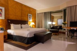 A bed or beds in a room at Lagos Continental Hotel