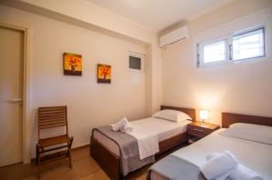 Postel nebo postele na pokoji v ubytování Ianthi Beach Villa by "elite"