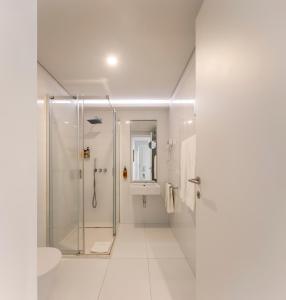 Et badeværelse på Lisbon Serviced Apartments - Estrela