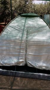 a tent that is wrapped in a tarp at Camping Paleochora in Palaiochora