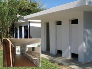 a picture of a white house with a porch at Camping Paleochora in Palaiochora