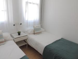 A bed or beds in a room at COZY, Beach House , by MAHBOVILLAS