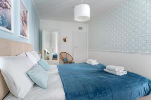 Posteľ alebo postele v izbe v ubytovaní Symphony Modern Tower Apartamenty
