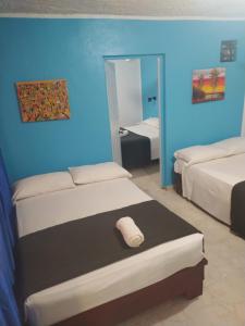 Postel nebo postele na pokoji v ubytování Hotel Pedernales Italia Republica Dominicana