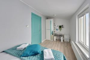 Posteľ alebo postele v izbe v ubytovaní Apartamenty Haffnera by Grand Apartments